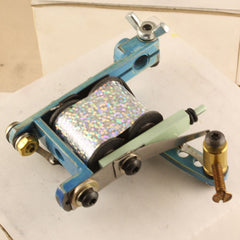 This is a handmade coil tattoo machine made for shading and coloring tattoos with tattoo ink and made for professional tattoo artists.